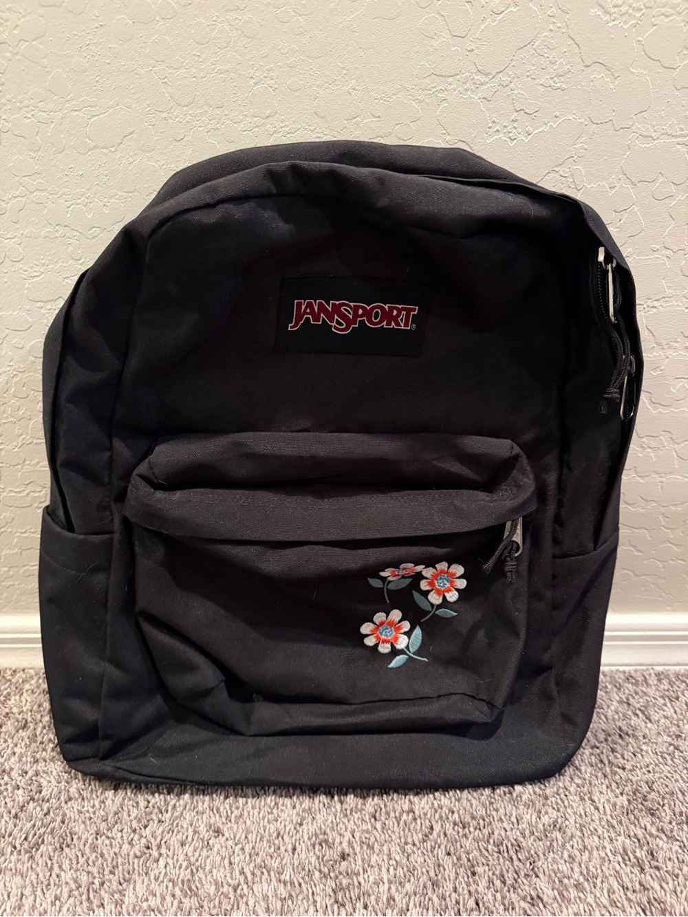 Jansport Black Backpack with Small Floral Embroidery